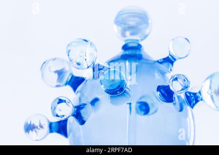 Abstract glass installation over light blue wall background Stock Photo