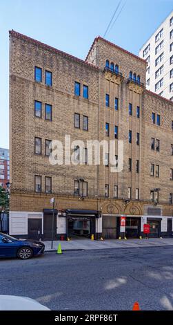 Upper West Side: Neo-Romanesque-styled brick-and-terra cotta parking garage on West 101st Street, off Broadway. Stock Photo