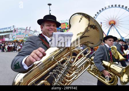 190923 -- BEIJING, Sept. 23, 2019 -- People participate in the Oktoberfest parade in Munich, Germany, Sept. 22, 2019. This year s Oktoberfest goes from Sept. 21 to Oct. 6.  XINHUA PHOTOS OF THE DAY LuxYang PUBLICATIONxNOTxINxCHN Stock Photo