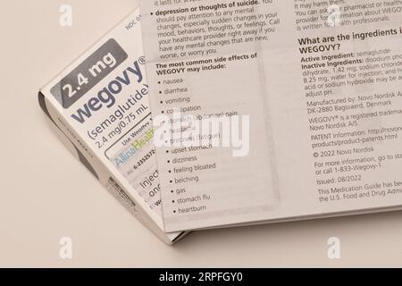 Still life of Wegovy an injectable prescription weight loss medicine with the side effects sheet that has helped people with obesity. It should be use Stock Photo