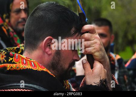 A Roman Catholic pilgrim called a Romeiro, prays before returning to their 8-day trek around the Azorean Island of Sao Miguel, March 30, 2023 in Furnãs, Portugal. The pilgrims visit 100 shrines and churches during the event dating from 1522 when an earthquake destroyed the first settlements. Stock Photo