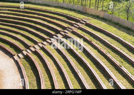 An auditorium modeled after ancient arenas with semi-circular benches on a hillside Stock Photo