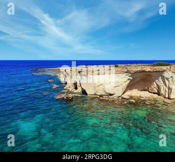 Grottoes on Spiaggia Massolivieri beach. Summer sea landscape (Siracusa, Sicily, Italy) Stock Photo