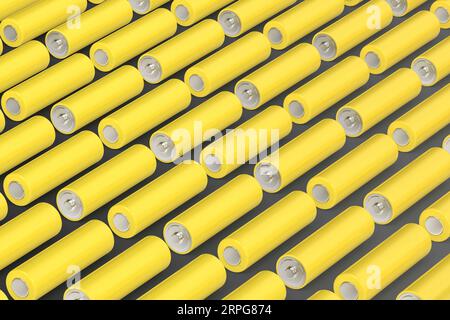 Many yellow AA size batteries Stock Photo