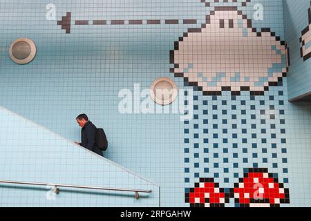 191010 -- STOCKHOLM, Oct. 10, 2019 -- A passenger walks in the Thorildsplan metro station in Stockholm, Sweden, Oct. 9, 2019. Till now, Stockholm s subway system consists of one hundred stations, each with unique art on its platform, walls or waiting hall. Since 1957, artists have been greatly involved in the building of new stations, and they also added beautiful statues, murals, and installations to the older stations.  SWEDEN-STOCKHOLM-TRANSPORTATION-METRO-ART ZhengxHuansong PUBLICATIONxNOTxINxCHN Stock Photo