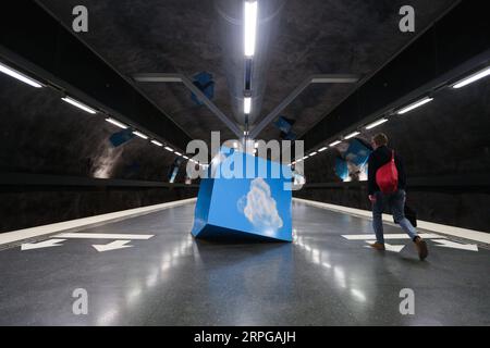 191010 -- STOCKHOLM, Oct. 10, 2019 -- A passenger walks in the Solna Strand metro station in Stockholm, Sweden, Oct. 8, 2019. Till now, Stockholm s subway system consists of one hundred stations, each with unique art on its platform, walls or waiting hall. Since 1957, artists have been greatly involved in the building of new stations, and they also added beautiful statues, murals, and installations to the older stations.  SWEDEN-STOCKHOLM-TRANSPORTATION-METRO-ART ZhengxHuansong PUBLICATIONxNOTxINxCHN Stock Photo