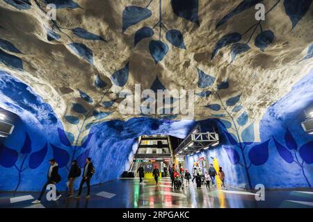 191010 -- STOCKHOLM, Oct. 10, 2019 -- Passengers walk in the T-Centralen metro station in Stockholm, Sweden, Oct. 8, 2019. Till now, Stockholm s subway system consists of one hundred stations, each with unique art on its platform, walls or waiting hall. Since 1957, artists have been greatly involved in the building of new stations, and they also added beautiful statues, murals, and installations to the older stations.  SWEDEN-STOCKHOLM-TRANSPORTATION-METRO-ART ZhengxHuansong PUBLICATIONxNOTxINxCHN Stock Photo