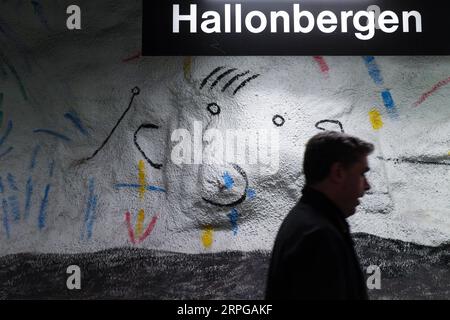 191010 -- STOCKHOLM, Oct. 10, 2019 -- A passenger walks in Hallonbergen metro station in Stockholm, Sweden, Oct. 8, 2019. Till now, Stockholm s subway system consists of one hundred stations, each with unique art on its platform, walls or waiting hall. Since 1957, artists have been greatly involved in the building of new stations, and they also added beautiful statues, murals, and installations to the older stations.  SWEDEN-STOCKHOLM-TRANSPORTATION-METRO-ART ZhengxHuansong PUBLICATIONxNOTxINxCHN Stock Photo