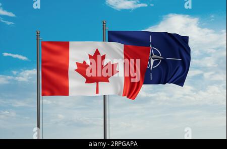 NATO flag and Canada flag waving together on blue sky Stock Photo