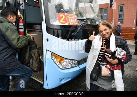 191011 -- LHASA, Oct. 11, 2019 -- An Indian pilgrim gets ready to take a coach in Yadong County, southwest China s Tibet Autonomous Region, June 20, 2019. TO GO WITH China Focus: Pilgrimage boosts exchanges between China, India  CHINA-TIBET-INDIA-PILGRIMAGE-EXCHANGE CN LixXin PUBLICATIONxNOTxINxCHN Stock Photo