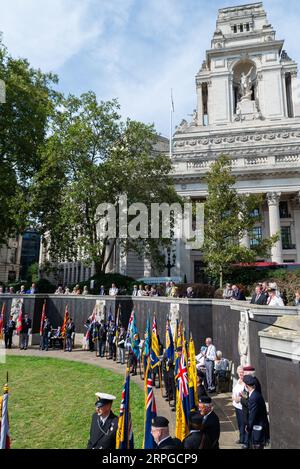 Merchant Navy Day Commemorative Service at CWGC Merchant Navy Memorial, Trinity Square Gardens, London, UK. Veterans at wartime losses memorial wall Stock Photo