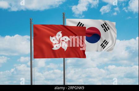 South Korea or Republic of Korea or ROK and Hong Kong flag waving together in the wind on blue sky, two country cooperation concept Stock Photo