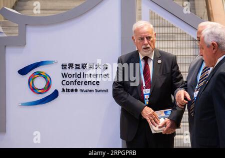 191020 -- TONGXIANG, Oct. 20, 2019 -- Attendants talk at the opening ceremony of the sixth World Internet Conference held in Wuzhen, east China s Zhejiang Province, Oct. 20, 2019.  CHINA-ZHEJIANG-WUZHEN-WORLD INTERNET CONFERENCE-OPENINGCN ZhangxXiaoyu PUBLICATIONxNOTxINxCHN Stock Photo