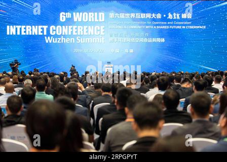 191020 -- TONGXIANG, Oct. 20, 2019 -- People attend the opening ceremony of the sixth World Internet Conference in Wuzhen, east China s Zhejiang Province, Oct. 20, 2019. The sixth World Internet Conference opened Sunday in Wuzhen. With the theme of Intelligent Interconnection for Openness and Cooperation -- Building a Community with a Shared Future in Cyberspace, the three-day conference will bring together more than 1,500 participants from over 80 countries and regions, including members of the Internet Hall of Fame, Nobel Prize winners and Turing Award winners.  CHINA-ZHEJIANG-TONGXIANG-WORL Stock Photo