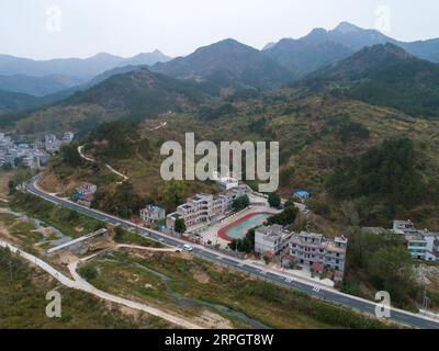 191022 -- LUOTIAN, Oct. 22, 2019 -- Aerial photo taken on Oct. 11, 2019 shows Hope primary school in Luotian County, central China s Hubei Province. Fang Rong, 29, is the headmaster of Hope primary school of Luotian County, her alma mater. Born in a poverty-stricken region, Fang Rong was a left-behind girl. Thanks to the Hope Project and people s aids, she succeeded in graduating from a secondary normal school. To help more children and repay people s kindness, she decided to be a teacher at her alma mater. In spite of the austere way of life, Fang shouldered her responsibility from various as Stock Photo