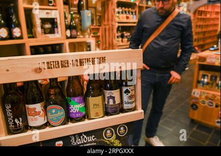 191024 -- BRUSSELS, Oct. 24, 2019 -- A customer selects beer at a shop in Brussels, Belgium, Oct. 23, 2019. With various, creative brewing skills, the Belgian beer has become one of the most attracting drinks for Belgium. Photo by /Xinhua BELGIUM-BRUSSELS-BEER RICCARDOxPAREGGIANI PUBLICATIONxNOTxINxCHN Stock Photo