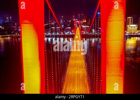 191024 -- CHONGQING, Oct. 24, 2019 -- Aerial photo taken on Oct. 22, 2019 shows a night view of Zhongxian County in the Three Gorges Reservoir region on the Yangtze River in southwest China s Chongqing Municipality.  CHINA-CHONGQING-THREE GORGES RESERVOIR-YANGTZE RIVER-NIGHT VIEW CN LiuxChan PUBLICATIONxNOTxINxCHN Stock Photo