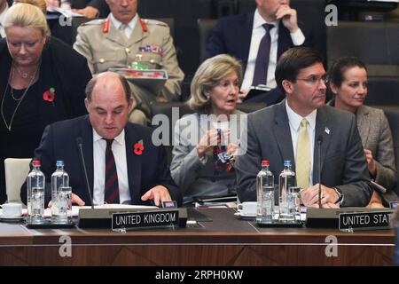 191025 -- BRUSSELS, Oct. 25, 2019 -- U.S. Secretary of Defense Mark Esper R, front and British Defense Secretary Ben Wallace L, front attend the meeting of the North Atlantic Council in Defence Ministers session at the NATO headquarters in Brussels, Belgium, Oct. 25, 2019.  BELGIUM-BRUSSELS-NATO-DM-SESSION ZhengxHuansong PUBLICATIONxNOTxINxCHN Stock Photo