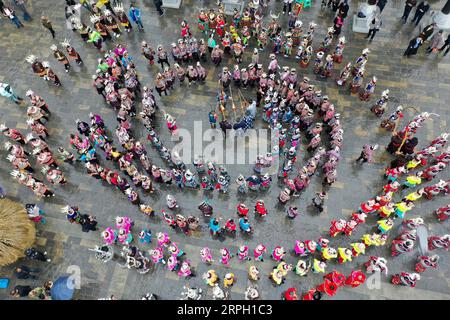 191026 -- DANZHAI, Oct. 26, 2019 -- In this aerial photo taken on Oct. 26, 2019, people of the Miao ethnic group perform a dance with Lusheng, a folk musical instrument made of bamboo pipes, in celebration of the Chixin festival in Danzhai County, Qiandongnan Miao and Dong Autonomous Prefecture, southwest China s Guizhou Province. Local residents of the Miao ethnic group were joined by tourists on Saturday in celebrating their traditional Chixin festival for this year s harvest.  CHINA-GUIZHOU-DANZHAI-CHIXIN FESTIVAL-CELEBRATION CN OuxDongqu PUBLICATIONxNOTxINxCHN Stock Photo