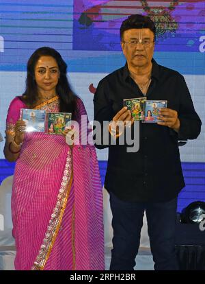 Mumbai, India. 04th Sep, 2023. L-R Bollywood actress Hema Malini and Indian music composer Anu Malik pose for a photo holding cds during the launch of bhajan (devotional song) 'Jhoola Jhoole Radha Rani' in Mumbai. Credit: SOPA Images Limited/Alamy Live News Stock Photo