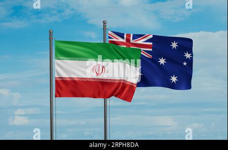 Australia flag and Iran flag waving together on blue sky, two country cooperation concept Stock Photo