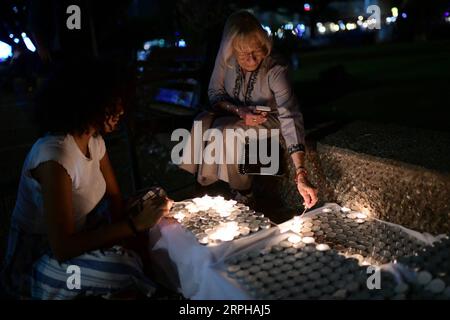 191103 -- TEL AVIV, Nov. 3, 2019 -- Israelis light candles during a rally marking the 24th anniversary of the assassination of former Prime Minister Yitzhak Rabin in Tel Aviv, Israel, Nov. 2, 2019. Rabin was assassinated by a right-wing Jewish extremist on Nov. 4, 1995 after a peace rally in support of the Oslo Accords in Tel Aviv. Tomer Neuberg/JINI via Xinhua ISRAEL-TEL AVIV-YITZHAK RABIN-ASSASSINATION-24TH ANNIVERSARY GuoxYu PUBLICATIONxNOTxINxCHN Stock Photo