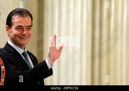 191104 -- BUCHAREST, Nov. 4, 2019 Xinhua -- Romania s new Prime Minister Ludovic Orban attends the swearing-in ceremony in Bucharest, Romania, on Nov. 4, 2019. Romania s new cabinet headed by National Liberal leader Ludovic Orban took the oath of office late Monday before President Klaus Iohannis at the Cotroceni Presidential Palace. Photo by Cristian Cristel/Xinhua ROMANIA-BUCHAREST-NEW GOVERNMENT-SWEARING-IN PUBLICATIONxNOTxINxCHN Stock Photo