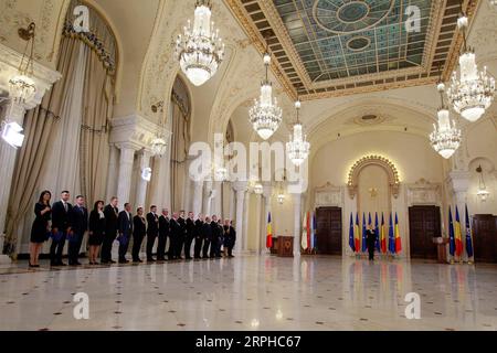 191104 -- BUCHAREST, Nov. 4, 2019 Xinhua -- Romania s new Prime Minister Ludovic Orban and members of the new cabinet attend the swearing-in ceremony in Bucharest, Romania, on Nov. 4, 2019. Romania s new cabinet headed by National Liberal leader Ludovic Orban took the oath of office late Monday before President Klaus Iohannis at the Cotroceni Presidential Palace. Photo by Cristian Cristel/Xinhua ROMANIA-BUCHAREST-NEW GOVERNMENT-SWEARING-IN PUBLICATIONxNOTxINxCHN Stock Photo