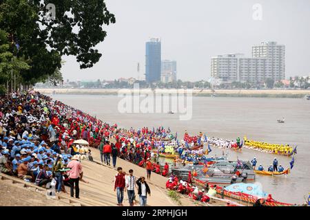 191110 -- PHNOM PENH, Nov. 10, 2019 Xinhua -- People watch boat races in the Tonle Sap river during the Water Festival in Phnom Penh, Cambodia on Nov. 10, 2019. Tens of thousands of spectators flocked to the riverside here on Sunday for an 838-year-old boat racing tradition, which is held to celebrate the annual Water Festival. TO GO WITH Feature: Tens of thousands cheer for centuries-old boat race in Cambodian capital Photo by Sovannara/Xinhua CAMBODIA-PHNOM PENH-WATER FESTIVAL-CELEBRATION PUBLICATIONxNOTxINxCHN Stock Photo