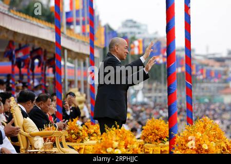 191110 -- PHNOM PENH, Nov. 10, 2019 Xinhua -- Cambodian King Norodom Sihamoni waves at boat racers during the Water Festival in Phnom Penh, Cambodia, Nov. 10, 2019. Tens of thousands of spectators flocked to the riverside here on Sunday for an 838-year-old boat racing tradition, which is held to celebrate the annual Water Festival. TO GO WITH Feature: Tens of thousands cheer for centuries-old boat race in Cambodian capital Photo by Sovannara/Xinhua CAMBODIA-PHNOM PENH-WATER FESTIVAL-CELEBRATION PUBLICATIONxNOTxINxCHN Stock Photo