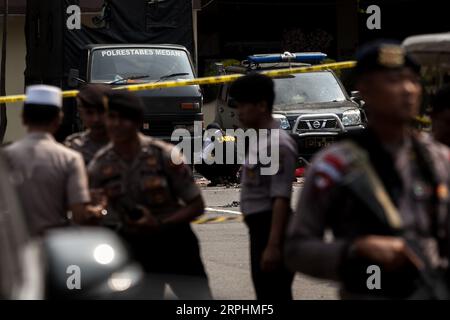 191113 -- MEDAN, Nov. 13, 2019 -- Police officers stand guard at the scene of a suicide bombing at Medan city police headquarters in Medan, North Sumatra, Indonesia, Nov. 13, 2019. A suicide bombing allegedly committed by unidentified persons occurred at a police station in Indonesian city of Medan in North Sumatra province at around 8:40 a.m. local time on Wednesday, injuring at least six people, according to a North Sumatra police spokesman. Photo by /Xinhua INDONESIA-MEDAN-SUICIDE BOMBING AndrixGinting PUBLICATIONxNOTxINxCHN Stock Photo