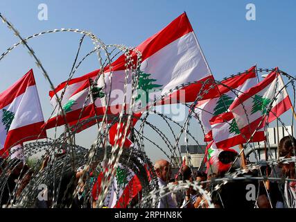191113 -- BEIRUT, Nov. 13, 2019 Xinhua -- People take part in a protest in Baabda, southeast of Beirut, Lebanon, on Nov. 13, 2019. Thousands of Lebanese demonstrators blocked streets all over Lebanon on Wednesday to express their outrage over President Michel Aoun s remarks in a televised interview a day earlier and the death of a protester in Khaldeh, south of Lebanon, the National News Agency reported. Photo by Bilal Jawich/Xinhua LEBANON-NATIONWIDE PROTESTS PUBLICATIONxNOTxINxCHN Stock Photo