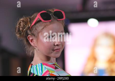 191123 -- MINSK, Nov. 23, 2019 Xinhua -- A child model presents new children s wear during the Kids Fashion Zone, a children s wear sale exhibition for charity, in Minsk, Belarus, Nov. 23, 2019. The activity was held here to mark the World Children s Day of 2019. Xinhua/Henadz Zhinkov BELARUS-MINSK-KIDS FASHION ZONE-WORLD CHILDREN S DAY-CELEBRATION PUBLICATIONxNOTxINxCHN Stock Photo