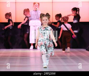 191123 -- MINSK, Nov. 23, 2019 Xinhua -- A child model presents new children s wear during the Kids Fashion Zone, a children s wear sale exhibition for charity, in Minsk, Belarus, Nov. 23, 2019. The activity was held here to mark the World Children s Day of 2019. Xinhua/Henadz Zhinkov BELARUS-MINSK-KIDS FASHION ZONE-WORLD CHILDREN S DAY-CELEBRATION PUBLICATIONxNOTxINxCHN Stock Photo