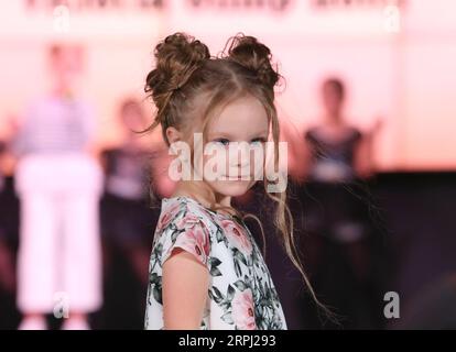 191123 -- MINSK, Nov. 23, 2019 Xinhua -- A child model presents new children s wear during the Kids Fashion Zone, a children s wear sale exhibition for charity, in Minsk, Belarus, Nov. 23, 2019. The activity was held here to mark the World Children s Day of 2019. Xinhua/Henadz Zhinkov BELARUS-MINSK-KIDS FASHION ZONE-WORLD CHILDREN S DAY-CELEBRATION PUBLICATIONxNOTxINxCHN Stock Photo