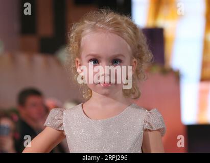 191123 -- MINSK, Nov. 23, 2019 Xinhua -- A child model presents new children s wear during the Kids Fashion Zone, a children s wear sale exhibition for charity, in Minsk, Belarus, Nov. 23, 2019. The activity was held here to mark the World Children s Day of 2019. Xinhua/Henadz Zhinkov BELARUS-MINSK-KIDS FASHION ZONE-WORLD CHILDREN S DAY-CELEBRATION PUBLICATIONxNOTxINxCHN Stock Photo