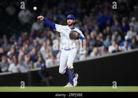 Dansby Swanson Chicago Cubs Autographed 8 x 10 White Jersey Swinging Photograph