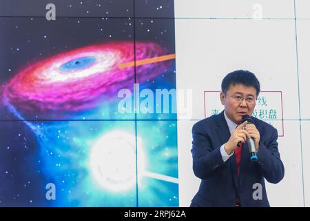191128 -- BEIJING, Nov. 28, 2019 -- Liu Jifeng, deputy director-general of the National Astronomical Observatory of the Chinese Academy of Sciences NAOC and the first author of the study, speaks during a press conference of the black hole LB-1 discovered with the Large Sky Area Multi-Object Fibre Spectroscopy Telescope LAMOST, in Beijing, capital of China, Nov. 27, 2019. A Chinese-led research team has discovered a surprisingly huge stellar black hole about 14,000 light years from Earth -- our backyard of the universe -- forcing scientists to re-examine how such black holes form. The team, hea Stock Photo