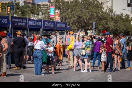 Large crowd of people are waiting in line to buy street food Stock Photo