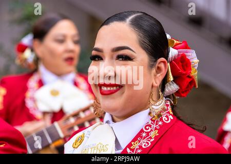 10.30.2022 - SAN ANTONIO, TX - Portrait of Angela Campos with Vanessa Moreno in the background of Mariachi Las Altenas, an all-female band Stock Photo