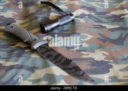 Tactical Blade Combat Hunting Survival Knife Set On Camouflage Cloth In Background Stock Photo