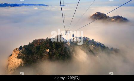 191208 -- HUAYIN, Dec. 8, 2019 -- The undated file photo shows the Taihua cableway in Mount Huashan, northwest China s Shaanxi Province. To keep the cableway running safely and efficiently, the annual maintenance of Taihua cableway for Mount Huashan has been carried out since Nov. 25 and will last until Dec. 15. Taihua cableway, which was opened to public in 2013, provides the stunning view of Mount Huashan, known for its steep peaks, for the visitors. CHINA-SHAANXI-MOUNT HUASHAN-CABLEWAY MAINTENANCE CN TaoxMing PUBLICATIONxNOTxINxCHN Stock Photo