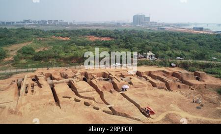 191208 -- NANCHANG, Dec. 8, 2019 -- Aerial photo taken on August 23, 2019 shows the ancient tombs excavated in Ganjiang New District, Nanchang, east China s Jiangxi Province. Archaeologists have excavated 73 ancient tombs dating back 1,400 years ago in east China s Jiangxi Province, the local institute of cultural relics and archeology said Saturday. It is believed that the majority of the discovered tombs were built in the Six Dynasties 222-589. The 8,000-square-meter site was discovered in June 2013. Excavation started in August 2018. CHINA-JIANGXI-ANCIENT TOMB CLUSTERS-DISCOVERY CN PengxZha Stock Photo