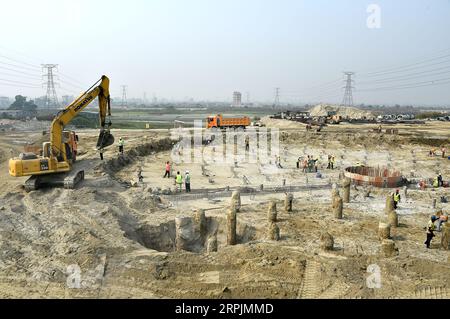 191215 -- DHAKA, Dec. 15, 2019 Xinhua -- Laborers work at a sewage treatment plant under construction in Dhaka, Bangladesh, Dec. 11, 2019. The construction of the China-funded Dasherkandi Sewage Treatment Plant Project , which started on August 2018, is now going on in full swing. The project includes sewage treatment plants, pumping stations and a sewage pipe network with a sewage treatment capacity of 500,000 cubic meters of sewage a day. Str/Xinhua BANGLADESH-DHAKA-SEWAGE-TREATMENT-PROJECT PUBLICATIONxNOTxINxCHN Stock Photo