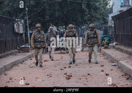 191217 -- NEW DELHI, Dec. 17, 2019 -- Indian policemen walk after clashing with protesters in New Delhi, India, Dec. 17, 2019. Fresh violence was reported from parts of Delhi on Tuesday against the new Citizenship Amendment Act CAA, which was passed by the country s Parliament last week, TV media reports said.  INDIA-NEW DELHI-PROTESTS-NEW CITIZENSHIP ACT JavedxDar PUBLICATIONxNOTxINxCHN Stock Photo