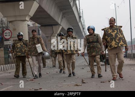 191217 -- NEW DELHI, Dec. 17, 2019 -- Indian policemen walk after clashing with protesters in New Delhi, India, Dec. 17, 2019. Fresh violence was reported from parts of Delhi on Tuesday against the new Citizenship Amendment Act CAA, which was passed by the country s Parliament last week, TV media reports said.  INDIA-NEW DELHI-PROTESTS-NEW CITIZENSHIP ACT JavedxDar PUBLICATIONxNOTxINxCHN Stock Photo