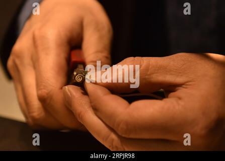 191218 -- BEIJING, Dec. 18, 2019 -- Dong Ruijing engraves Chinese ...