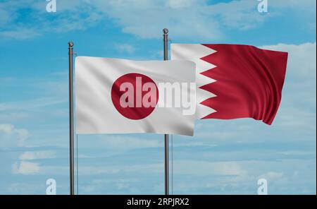 Bahrain flag and Japan flag waving together on blue sky, two country cooperation concept Stock Photo