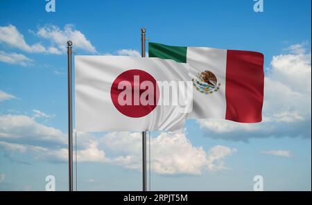 Mexico flag and Japan flag waving together on blue sky, two country cooperation concept Stock Photo