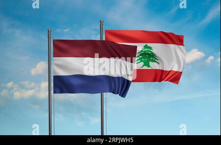 Lebanon and Netherlands flag waving together in the wind on blue sky, two country cooperation concept Stock Photo